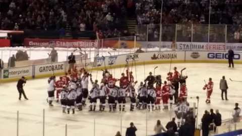 Colorado Avalanche and Detroit Red Wings alumni salute at the end of the game. Photo credit: Nadia Archuleta