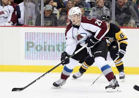 Oct 17, 2016; Pittsburgh, PA, USA; Colorado Avalanche center Nathan MacKinnon (29) skates with the puck ahead of Pittsburgh Penguins right wing Phil Kessel (81) during the second period at the PPG Paints Arena. Mandatory Credit: Charles LeClaire-USA TODAY Sports