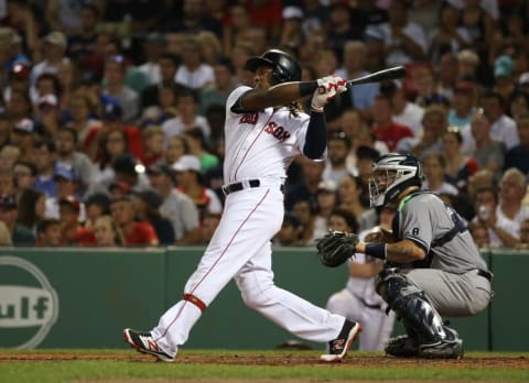 Aug 11, 2016; Boston, MA, USA; Boston Red Sox first baseman Hanley Ramirez (13) hits an RBI double against the New York Yankees during the fifth inning at Fenway Park. Mandatory Credit: Mark L. Baer-USA TODAY Sports