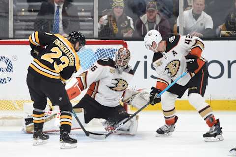 BOSTON, MA – DECEMBER 20: Jakob Forsbacka Karlsson #23 of the Boston Bruins fights for the puck against John Gibson #36 and Josh Manson #42 of the Anaheim Ducks at the TD Garden on December 20, 2018 in Boston, Massachusetts. (Photo by Steve Babineau/NHLI via Getty Images)