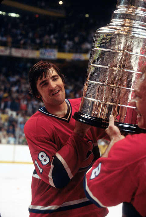 BOSTON, MA – MAY 25: Serge Savard #18 of the Montreal Canadiens holds over his head the Stanley Cup after the Canadiens defeated the Boston Bruins in the NHL Stanley Cup Finals 4 games to 2 on May 25, 1978 at the Boston Garden in Boston, Massachusetts. Savard’s playing career went from 1966-83. (Photo by Focus on Sport/Getty Images)