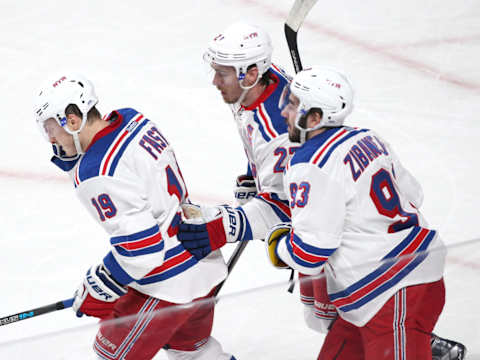 Apr 20, 2017; Montreal, Quebec, CAN; New York Rangers right wing Jesper Fast (19) celebrates his goal against Montreal Canadiens with teammates center Mika Zibanejad (93) and defenseman Ryan McDonagh (27) during the first period in game five of the first round of the 2017 Stanley Cup Playoffs at Bell Centre. Mandatory Credit: Jean-Yves Ahern-USA TODAY Sports