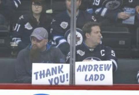 Feb 23, 2016; Winnipeg, Manitoba, CAN; Winnipeg Jets fans thank Winnipeg Jets left wing Andrew Ladd (16) prior to the game against the Dallas Stars at MTS Centre. Mandatory Credit: Bruce Fedyck-USA TODAY Sports