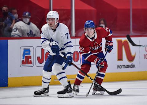 MONTREAL, QC – APRIL 28: Adam Brooks #77 of the Toronto Maple Leafs and Cole Caufield #22 of the Montreal Canadiens watch as the puck is played during the third period at the Bell Centre on April 28, 2021 in Montreal, Canada. The Toronto Maple Leafs defeated the Montreal Canadiens 4-1. (Photo by Minas Panagiotakis/Getty Images)