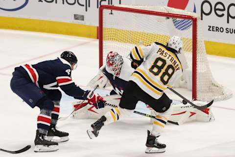 Apr 8, 2021; Washington, District of Columbia, USA; Washington Capitals goaltender Ilya Samsonov (30) makes a save on Boston Bruins right wing David Pastrnak (88) in the third period at Capital One Arena. Mandatory Credit: Geoff Burke-USA TODAY Sports