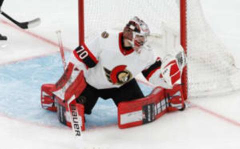 Kevin Mandolese of the Ottawa Senators makes a glove save against the Boston Bruins  | Photo by Richard T Gagnon for Getty Images