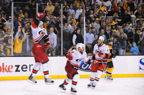 BOSTON – MAY 14: Eric Staal #12, Scott Walker #24 and Dennis Seidenberg #4 of the Carolina Hurricanes celebrate after beating the Boston Bruins in overtime in Game Seven of the Eastern Conference Semifinal round of the 2009 Stanley Cup Playoffs at the TD Banknorth Garden on May 14, 2009 in Boston, Massachusetts. (Photo by Brian Babineau/NHLI via Getty Images)