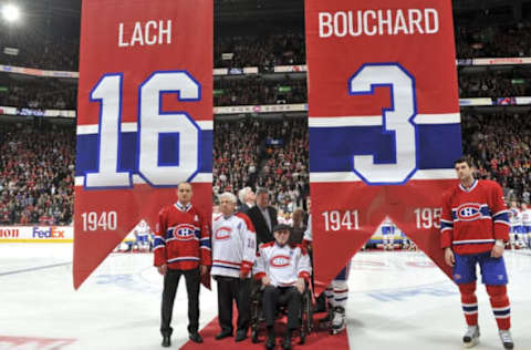 MONTREAL, QC – DECEMBER 4: Elmer Lach, Emile Bouchard (seated) on the Bell Centre ice with their families during the celebrations for the retirement of their jerseys before the NHL game against the Boston Bruins on December 4, 2009, Quebec, Canada. (Photo by Francois Lacasse/NHLI via Getty Images)