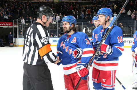 NEW YORK, NY – JANUARY 15: Referee Brad Watson shakes hands with Mats Zuccarello #36 of the New York Rangers after working his final game at Madison Square Garden following the game against the Carolina Hurricanes on January 15, 2019 in New York City. The New York Rangers won 6-2. (Photo by Jared Silber/NHLI via Getty Images)