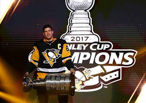 PITTSBURGH, PA – OCTOBER 04: Sidney Crosby #87 of the Pittsburgh Penguins brings the Stanley Cup to the ice before to raising their 2017 championship banner prior to playing the St. Louis Blues at PPG PAINTS Arena on October 4, 2017 in Pittsburgh, Pennsylvania. (Photo by Gregory Shamus/Getty Images)