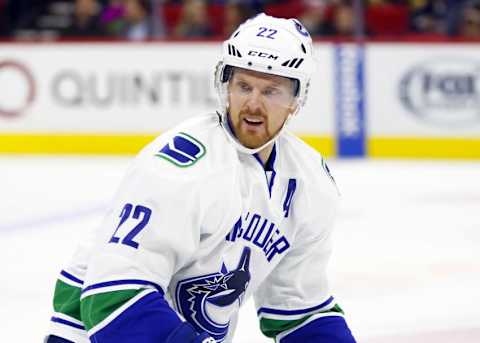 Jan 15, 2016; Raleigh, NC, USA; Vancouver Canucks forward Daniel Sedin (22) watches the play against the Carolina Hurricanes at PNC Arena. The Vancouver Canucks defeated the Carolina Hurricanes 3-2 in overtime. Mandatory Credit: James Guillory-USA TODAY Sports