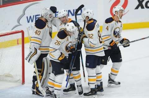 Nov 1, 2016; Saint Paul, MN, USA; Buffalo Sabres defenseman Dmitry Kulikov (77) congratulates goalie Robin Lehner (40) on a win against the Minnesota Wild at Xcel Energy Center. The Sabres win 2-1 over the wild. Mandatory Credit: Marilyn Indahl-USA TODAY Sports