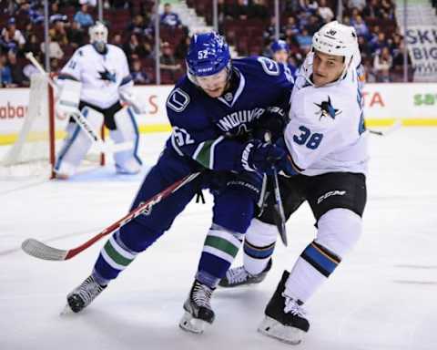 Sep 22, 2015; Vancouver, British Columbia, CAN; San Jose Sharks forward Michael Haley (38) defends against Vancouver Canucks forward Cole Cassels (52) during the first period at Rogers Arena. Mandatory Credit: Anne-Marie Sorvin-USA TODAY Sports