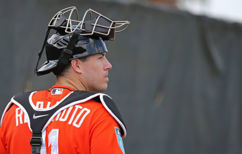 Miami Marlins catcher J.T. Realmuto looks on during the spring training baseball workouts for pitchers and catchers on Wednesday, February 14, 2018 at Roger Dean Stadium in Jupiter, Fla. (David Santiago/Miami Herald/TNS via Getty Images)