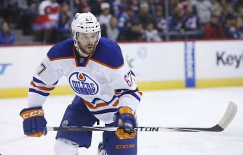 Jan 2, 2015; Denver, CO, USA; Edmonton Oilers left wing Benoit Pouliot (67) during the third period against the Colorado Avalanche at Pepsi Center. The Avalanche won 2-1 in overtime. Mandatory Credit: Chris Humphreys-USA TODAY Sports