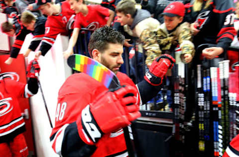 RALEIGH, NC – MARCH 24: Jordan Martinook #48 of the Carolina Hurricanes enters the ice with pride tape on his blade to honor Pride Night during the Hockey is for Everyone initiative prior to an NHL game on March 24, 2019 at PNC Arena in Raleigh, North Carolina. (Photo by Gregg Forwerck/NHLI via Getty Images)