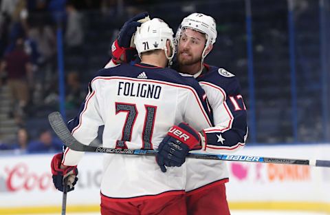 Apr 12, 2019; Tampa, FL, USA; Columbus Blue Jackets left wing Nick Foligno (71), center Brandon Dubinsky (17) celebrate as they beat the Tampa Bay Lightning during the third period of game two of the first round of the 2019 Stanley Cup Playoffs at Amalie Arena. Mandatory Credit: Kim Klement-USA TODAY Sports