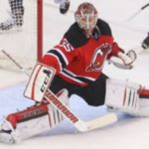 Feb 6, 2016; Newark, NJ, USA; New Jersey Devils goalie Cory Schneider (35) makes a save during overtime against the Washington Capitals at Prudential Center. The Capitals defeated the Devils 3-2 in a shootout. Mandatory Credit: Ed Mulholland-USA TODAY Sports