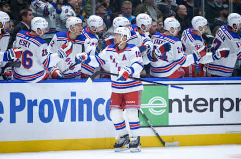 VANCOUVER, CANADA – OCTOBER 28: Artemi Panarin #10 of the New York Rangers is congratulated at the players’ bench after scoring a goal against the Vancouver Canucks during the first period of their NHL game at Rogers Arena on October 28, 2023, in Vancouver, British Columbia, Canada. (Photo by Derek Cain/Getty Images)