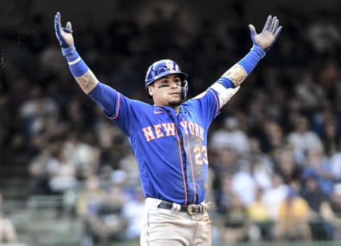 Sep 26, 2021; Milwaukee, Wisconsin, USA; New York Mets shortstop Javier Baez (23) reacts after hitting a double to drive in 2 runs in the fourth inning against the Milwaukee Brewers at American Family Field. Mandatory Credit: Benny Sieu-USA TODAY Sports