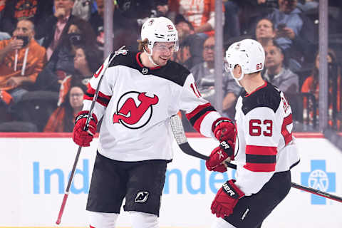 Alexander Holtz #10 (L) and Jesper Bratt #63 of the New Jersey Devils. (Photo by Tim Nwachukwu/Getty Images)