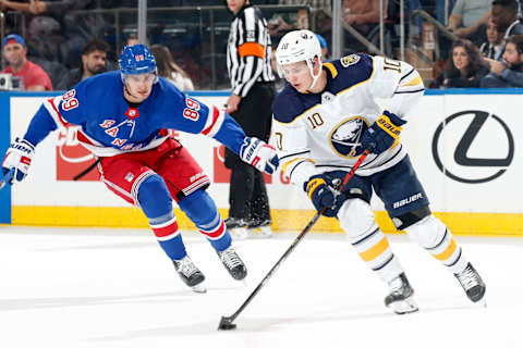 NEW YORK, NY – OCTOBER 24: Henri Jokiharju #10 of the Buffalo Sabres skates with the puck against Pavel Buchnevich #89 of the New York Rangers at Madison Square Garden on October 24, 2019 in New York City. (Photo by Jared Silber/NHLI via Getty Images)