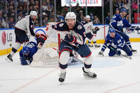 Feb 11, 2023; Toronto, Ontario, CAN; Columbus Blue Jackets defenseman Andrew Peeke (2) chases after a puck against the Toronto Maple Leafs during the third period at Scotiabank Arena. Mandatory Credit: John E. Sokolowski-USA TODAY Sports