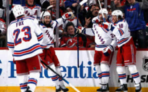 NEWARK, NEW JERSEY – APRIL 20: (L-R) Adam Fox #23, Mika Zibanejad #93, Chris Kreider #20, and Artemi Panarin #10 celebrate a powerplay goal by Kreider at 9:57 of the second period against the New Jersey Devils during Game Two in the First Round of the 2023 Stanley Cup Playoffs at the Prudential Center on April 20, 2023 in Newark, New Jersey. (Photo by Bruce Bennett/Getty Images)