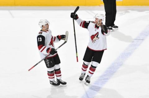 EDMONTON, AB – FEBRUARY 19: Vinnie Hinostroza #13 and Jordan Oesterle #82 of the Arizona Coyotes celebrate after winning the game against the Edmonton Oilers on February 19, 2019 at Rogers Place in Edmonton, Alberta, Canada. (Photo by Andy Devlin/NHLI via Getty Images)