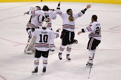 The Chicago Blackhawks celebrate after teammate Patrick Kane #88 scored (Photo by Al Bello/Getty Images)