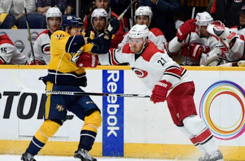 NASHVILLE, TN – OCTOBER 8: James Wisniewski #21 of the Carolina Hurricanes battles with Viktor Arvidsson #38 of the Nashville Predators at Bridgestone Arena on October 8, 2015, in Nashville, Tennessee. (Photo by Sanford Myers/Getty Images)