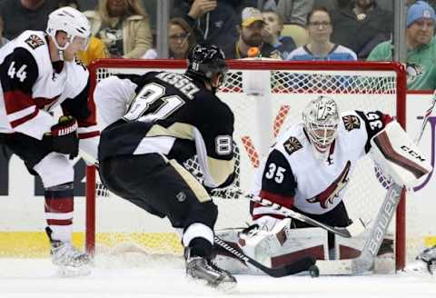 Feb 29, 2016; Pittsburgh, PA, USA; Arizona Coyotes goalie Louis Domingue (35) makes a save against Pittsburgh Penguins right wing Phil Kessel (81) as Coyotes defenseman Kevin Connauton (44) defends during the third period at the CONSOL Energy Center. The Penguins won 6-0. Mandatory Credit: Charles LeClaire-USA TODAY Sports