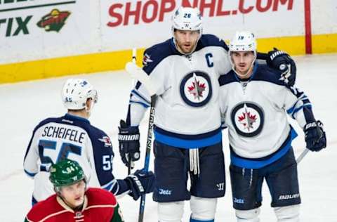 Nov 23, 2016; Saint Paul, MN, USA; Winnipeg Jets forward Blake Wheeler (26) celebrates his goal with teammates during the third period against the Minnesota Wild at Xcel Energy Center. The Wild defeated the Jets 3-1. Mandatory Credit: Brace Hemmelgarn-USA TODAY Sports