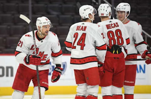 Mar 14, 2021; Detroit, Michigan, USA; Carolina Hurricanes right wing Nino Niederreiter (21) celebrates his goal during the third period against the Detroit Red Wings at Little Caesars Arena. Mandatory Credit: Tim Fuller-USA TODAY Sports