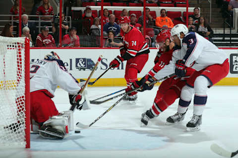 RALEIGH, NC – OCTOBER 10: Seth Jones #3 of the Columbus Blue Jackets ties up the stick of Jordan Staal #11 of the Carolina Hurricanes as Sergei Bobrovsky #72 defends the goal during an NHL game on October 10, 2017 at PNC Arena in Raleigh, North Carolina. (Photo by Gregg Forwerck/NHLI via Getty Images)