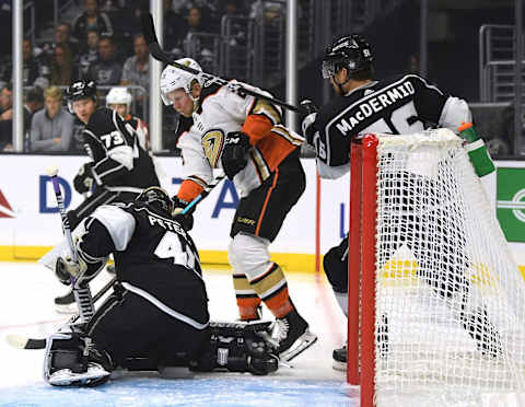 LOS ANGELES, CALIFORNIA – SEPTEMBER 23: Ondrej Kase #25 of the Anaheim Ducks takes a shot in front of Cal Petersen #40 and Kurtis MacDermid #56 of the Los Angeles Kings during a preseason game at at Staples Center on September 23, 2019 in Los Angeles, California. (Photo by Harry How/Getty Images)