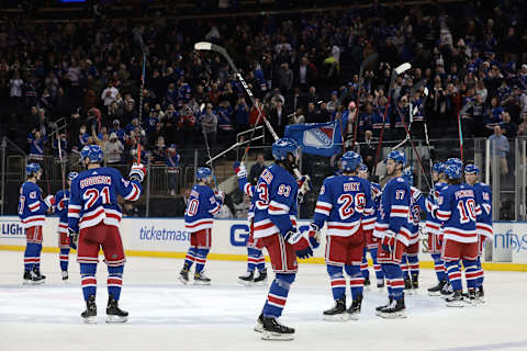 Feb 24, 2022; New York, New York, USA; New York Rangers center Mika Zibanejad (93) and center Barclay Goodrow (21) salute the fans with teammates after defeating the Washington Capitals at Madison Square Garden. Mandatory Credit: Vincent Carchietta-USA TODAY Sports