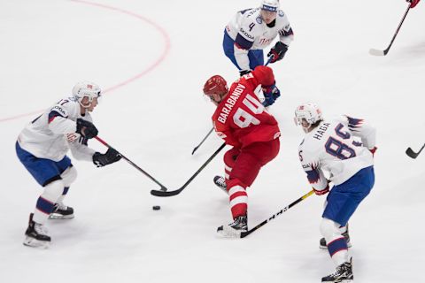 Russias forward Alexander Barabanov (C).n Bratislava. (Photo by VLADIMIR SIMICEK / AFP) (Photo credit should read VLADIMIR SIMICEK/AFP via Getty Images)