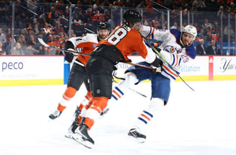 PHILADELPHIA, PENNSYLVANIA – OCTOBER 19: Marc Staal #18 of the Philadelphia Flyers collides with Leon Draisaitl #29 of the Edmonton Oilers during the first period at the Wells Fargo Center on October 19, 2023 in Philadelphia, Pennsylvania. (Photo by Tim Nwachukwu/Getty Images)