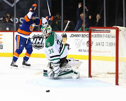 Jan 3, 2016; Brooklyn, NY, USA; New York Islanders right wing Cal Clutterbuck (15) reacts after scoring a goal as Dallas Stars goaltender Kari Lehtonen (32) looks away during the second period at Barclays Center. Mandatory Credit: Andy Marlin-USA TODAY Sports