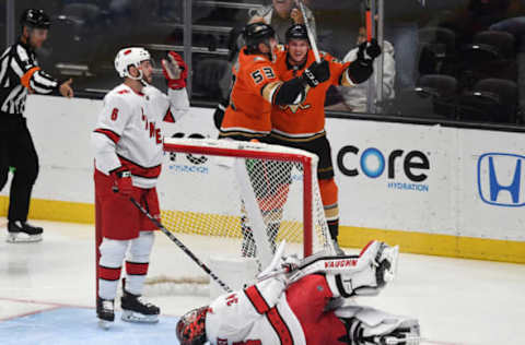 ANAHEIM, CA – OCTOBER 18: Anaheim Ducks right wing Jakob Silfverberg (33) and left wing Max Comtois (53) celebrate behind the net and Carolina Hurricanes goalie Petr Mrazek (34) after Silfverberg scored a goal in the second period of a game played on October 18, 2019 at the Honda Center in Anaheim, CA. (Photo by John Cordes/Icon Sportswire via Getty Images)