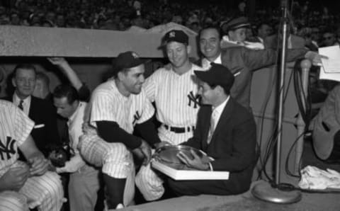 Yogi Berra and Mickey Mantle with singer Eddie Fisher in 1956.  (Photo by: Olen Collection/Diamond Images/Getty Images)