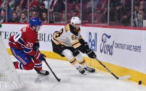 MONTREAL, QC – NOVEMBER 26: Jack Studnicka #68 of the Boston Bruins skates the puck against Cale Fleury #20 of the Montreal Canadiens during the first period at the Bell Centre on November 26, 2019 in Montreal, Canada. The Boston Bruins defeated the Montreal Canadiens 8-1. (Photo by Minas Panagiotakis/Getty Images)