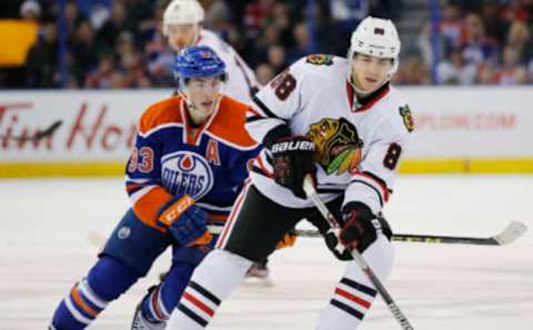 Chicago Blackhawks forward Patrick Kane (88) keeps the puck from Edmonton Oilers forward Ryan Nugent-Hopkins (93) Mandatory Credit: Perry Nelson-USA TODAY Sports