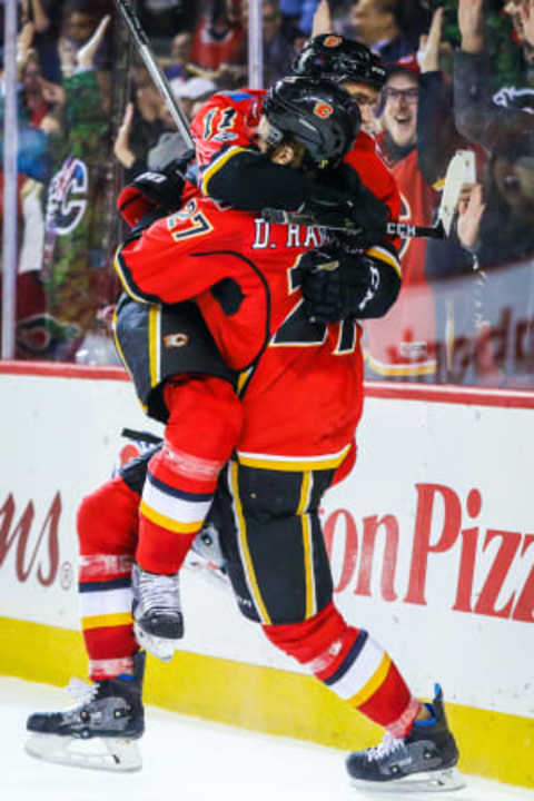 Jan 11, 2017; Calgary, Alberta, CAN; Calgary Flames defenseman Dougie Hamilton (27) celebrates his goal with center Mikael Backlund (11) during the third period against the San Jose Sharks at Scotiabank Saddledome. Calgary Flames won 3-2. Mandatory Credit: Sergei Belski-USA TODAY Sports