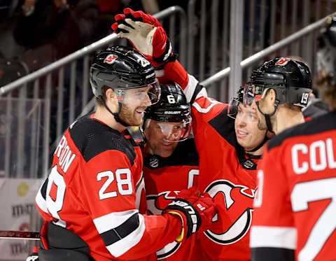 Damon Severson #28 and Travis Zajac #19 of the New Jersey Devils (Photo by Elsa/Getty Images)