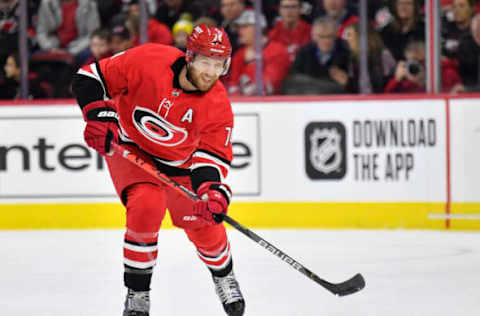 RALEIGH, NORTH CAROLINA – FEBRUARY 16: Jaccob Slavin #74 of the Carolina Hurricanes moves the puck against the Edmonton Oilers during the second period at PNC Arena on February 16, 2020 in Raleigh, North Carolina. The Oilers won 4-3 in overtime. (Photo by Grant Halverson/Getty Images)