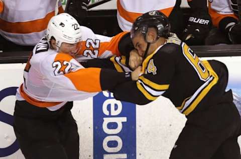 BOSTON – OCTOBER 8: (second period) Philadelphia Flyers defenseman Luke Schenn (#22) and Boston Bruins center Bobby Robins (#64) mix it up in the second period. The Boston Bruins take on the Philadelphia Flyers in the season home opener at TD Garden. (Photo by Barry Chin/The Boston Globe via Getty Images)