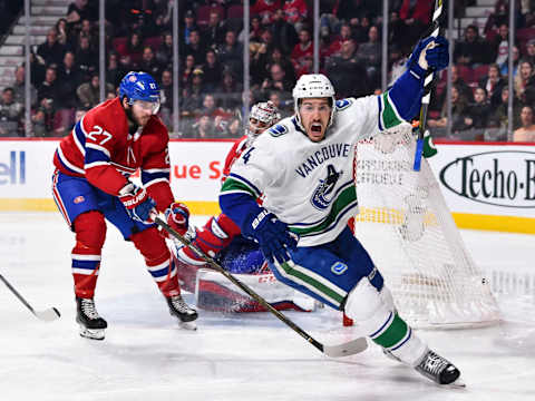 MONTREAL, QC – JANUARY 07: Michael Del Zotto #4 of the Vancouver Canucks reacts after scoring a goal in the third period against the Montreal Canadiens during the NHL game at the Bell Centre on January 7, 2018 in Montreal, Quebec, Canada. The Montreal Canadiens defeated the Vancouver Canucks 5-2. (Photo by Minas Panagiotakis/Getty Images)