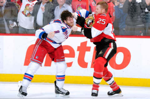 OTTAWA, CANADA – APRIL 23: Chris Neil #25 of the Ottawa Senators and Brandon Prust #8 of the New York Rangers fight in Game Six of the Eastern Conference Quarterfinals during the 2012 NHL Stanley Cup Playoffs at the Scotiabank Place on April 23, 2012 in Ottawa, Ontario, Canada. (Photo by Richard Wolowicz/Getty Images)